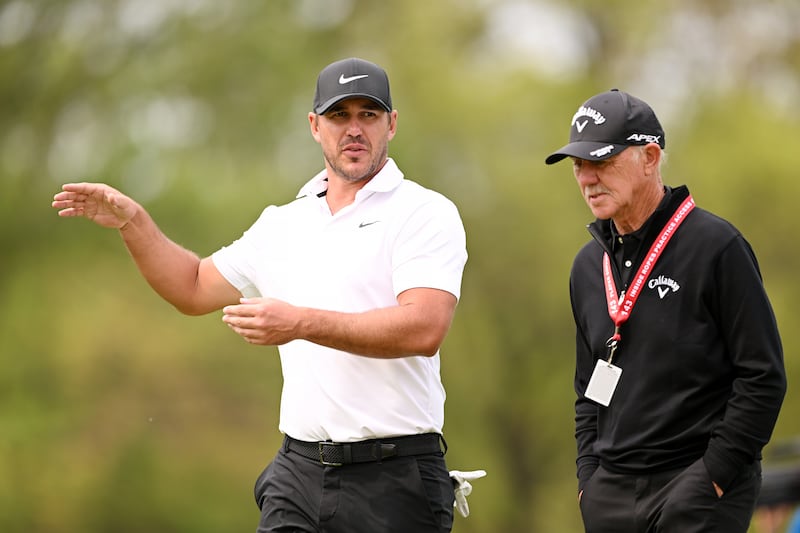 Brooks Koepka and his coach Pete Cowen. Photograph: Ross Kinnaird/Getty