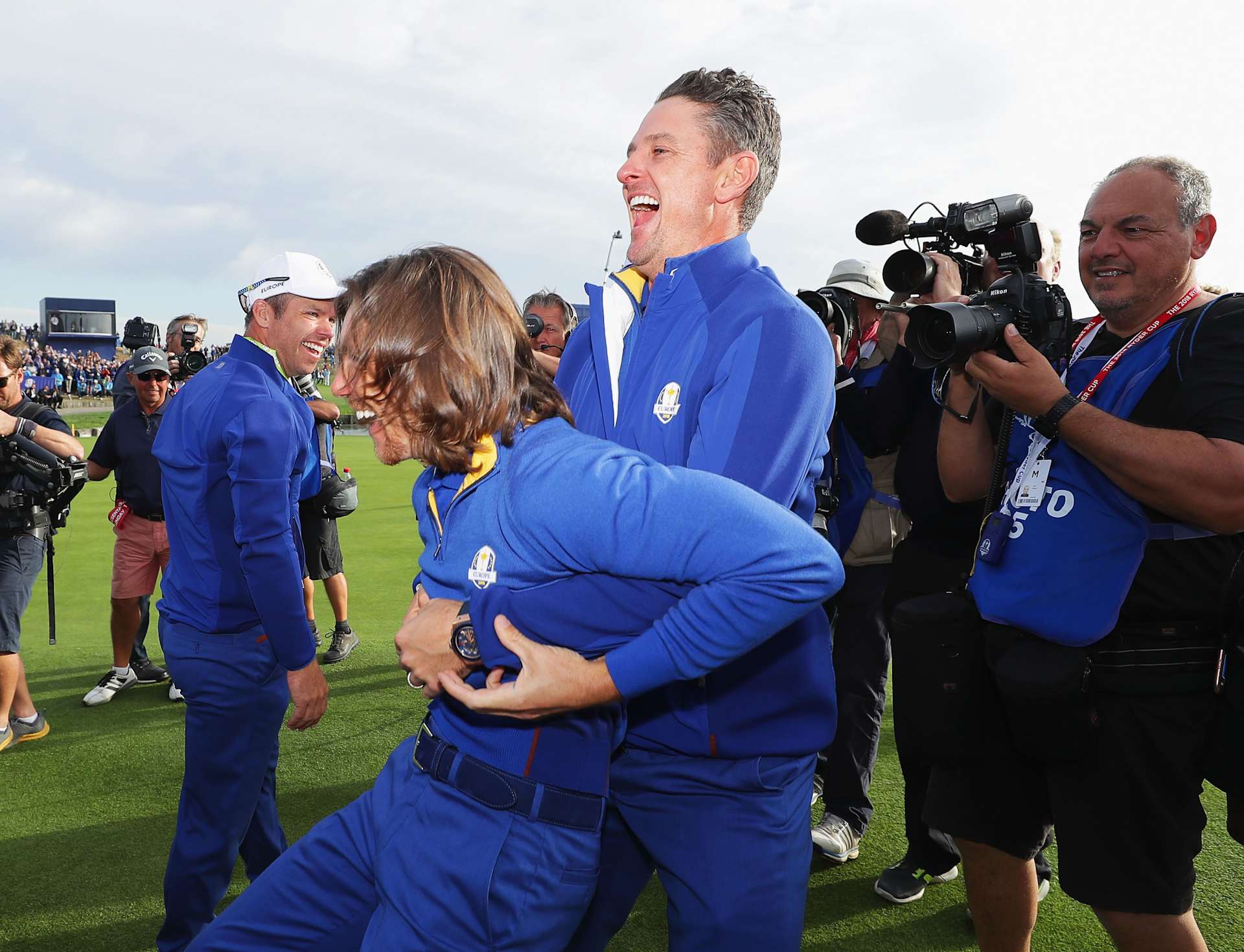 PARIS, FRANCE - SEPTEMBER 30:  Tommy Fleetwood of Europe and Justin Rose of Europe celebrate winning The Ryder Cup during singles matches of the 2018 Ryder Cup at Le Golf National on September 30, 2018 in Paris, France.  (Photo by Richard Heathcote/Getty Images)