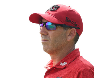 Sergio Garcia from the shoulders up, wearing a red polo, red cap and sunglasses