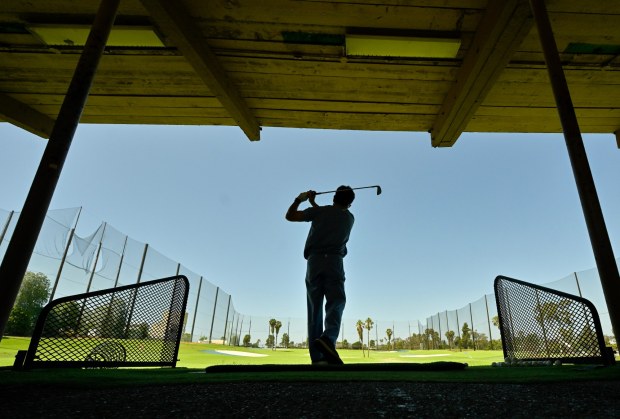 Golfer Tad Funahashi at the driving range at Newport Beach Golf Course in Newport Beach, CA, on Tuesday, June 17, 2025. The city's Planning Commission is set to hear a proposal for a surf park at the site. The proposal would create a 5-acre surf lagoon with warming pools, a spa and a seating area on the 15.38-acre site. (Photo by Jeff Gritchen, Orange County Register/SCNG)