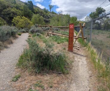A fence and warning sign limit access to an unofficial path off of Gib's Loop trail near the 29th Street Trailhead in Ogden on Tuesday, May 6, 2025. (Ryan Olson, Standard-Examiner)