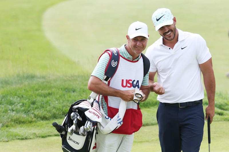 Brooks Koepka (right) and caddie Ricky Elliott on the seventh green during the second round of the 2022 US Open in Brookline, Massachusetts. Photograph: Warren Little/Getty Images