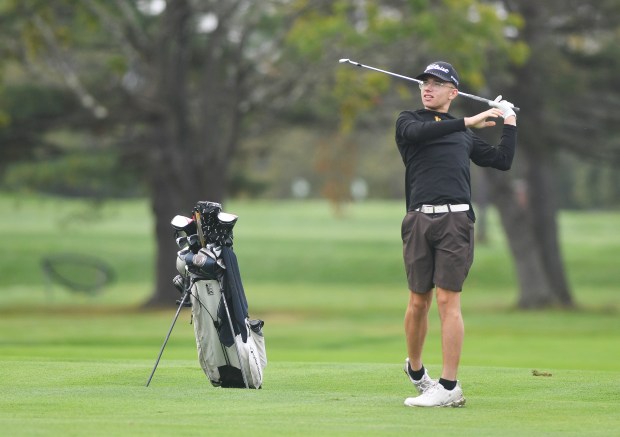 Lake-Lehman’s Jackson Norconk swings from the fairway on the second...