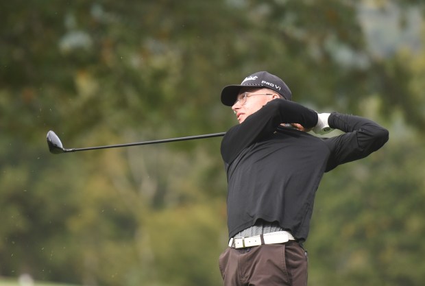 Lake-Lehman’s Jackson Norconk follows through with a drive at Fox...