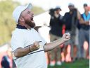 Shane Lowry of Team Europe makes his putt to halve the hole and retain the Ryder Cup on the 18th green during the Sunday singles matches of the 2025 Ryder Cup at Black Course at Bethpage State Park Golf Course on September 28, 2025 in Farmingdale, New York. 