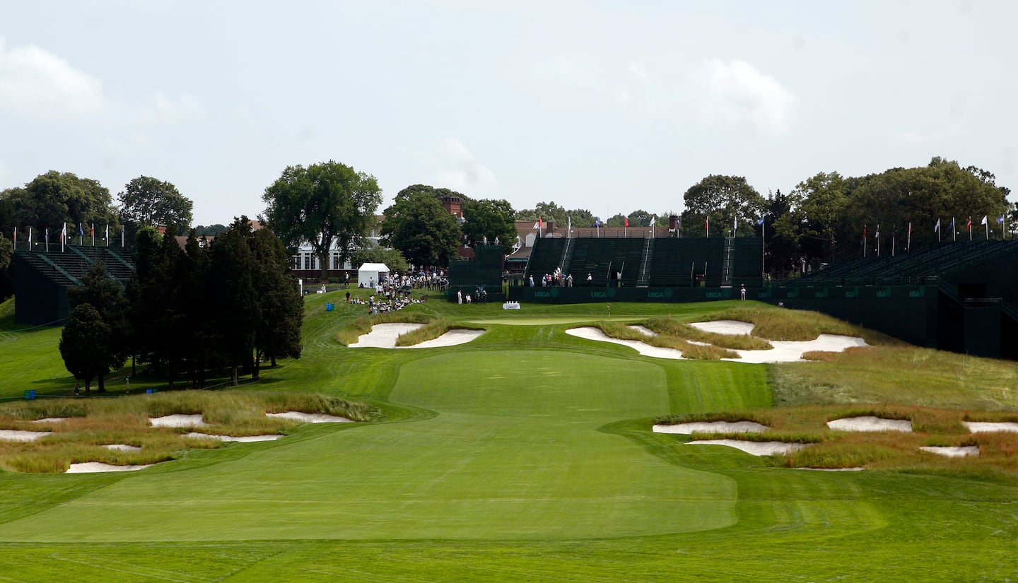 Bunkers are everywhere at Bethpage Black, including on the narrow 18th.