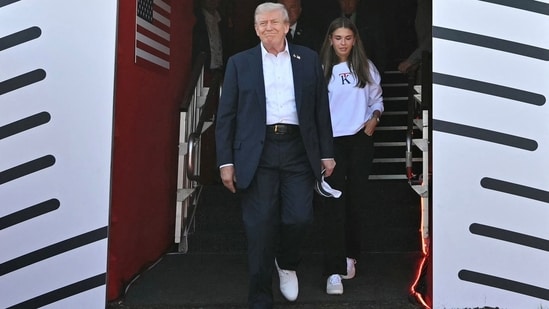 U.S. President Donald Trump and his granddaughter Kai Trump attend the 45th Ryder Cup golf competition at Bethpage Black Golf Course in Farmingdale, New York.(via REUTERS)