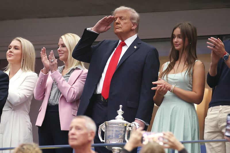 White House Press Secretary Karoline Leavitt, Attorney General Pam Bondi,  U.S. President Donald Trump and granddaughter to Donald Trump Arabella Kushner stand for the national anthem.