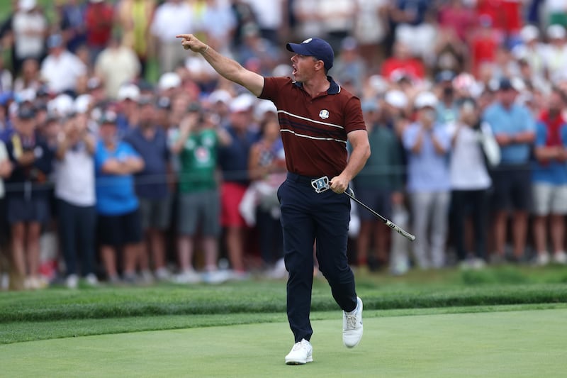 Rory McIlroy yells to the crowd as he walks off the 17th green during the Saturday afternoon four-balls matches. Photograph: Carl Recine/Getty Images