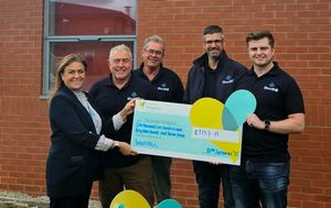 Staff at Shoothill IT present a cheque to Severn Hospice after their charity golf day event