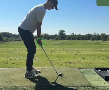 Hands moving towards ball causing hosel