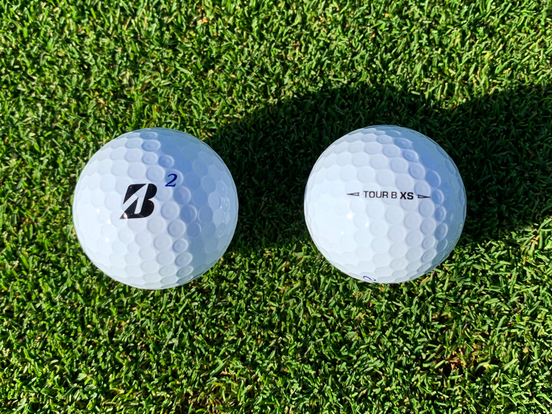 The Bridgestone Tour B XS on grass showing logos