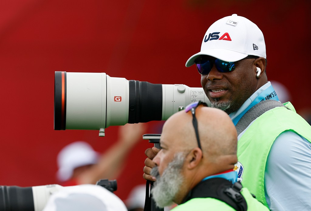 Ken Griffey Jr. photographing on the first hole of Ryder Cup 2025 at Black Course.