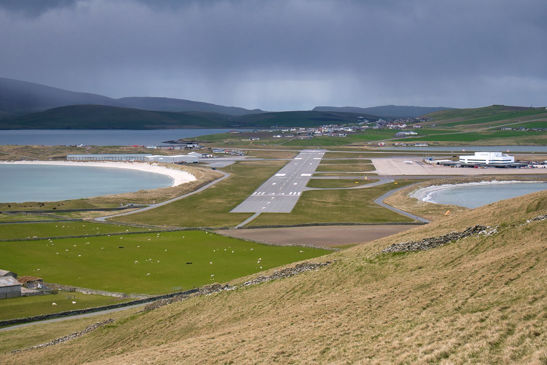 The road south from Lerwick cuts across the runway of Sumburgh Airport on Shetland.