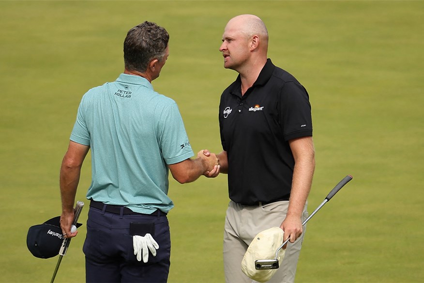 Harry Hall shakes hands with Justin Rose after their round at the Tour Championship with his Odyssey O-Works 1W DB putter in hand