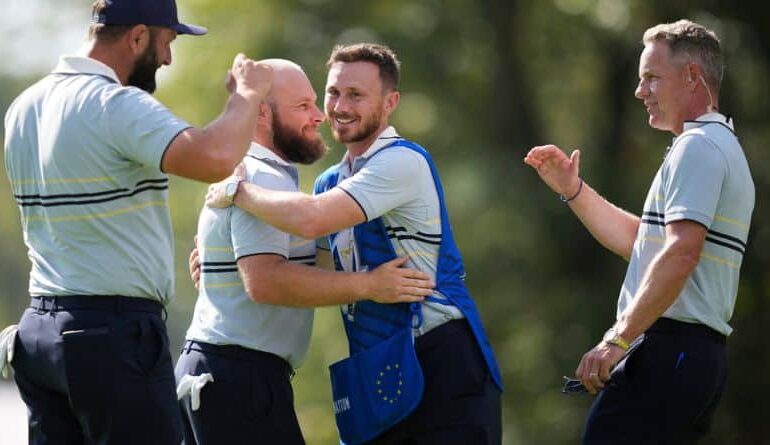 Europe's Jon Rahm, Tyrrell Hatton and captain Luke Donald celebrate after their win on the 15th hole at Bethpage Black golf course during the Ryder Cup golf tournament, Friday, Sept. 26, 2025, in Farmingdale, N.Y. (AP Photo/Matt Slocum)