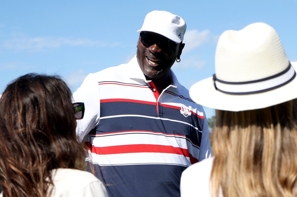 Michael Jordan speaking with wives of players from Team Europe at the 2025 Ryder Cup.