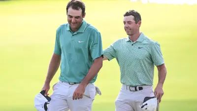 Aug 28, 2022; Atlanta, Georgia, USA; Scottie Scheffler and Rory McIlroy walk of the 18th green during the final round of the TOUR Championship golf tournament.