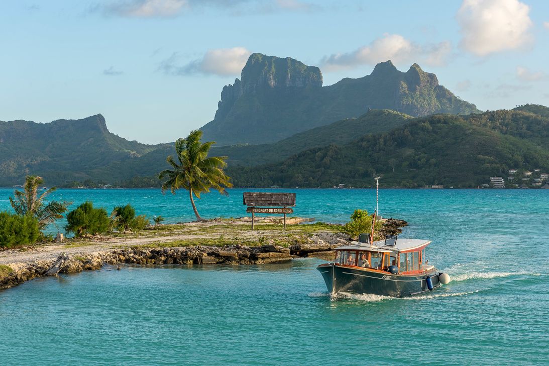 At Bora Bora airport you'll land on a thin motu (island) in a lagoon and take a boat from baggage claim.