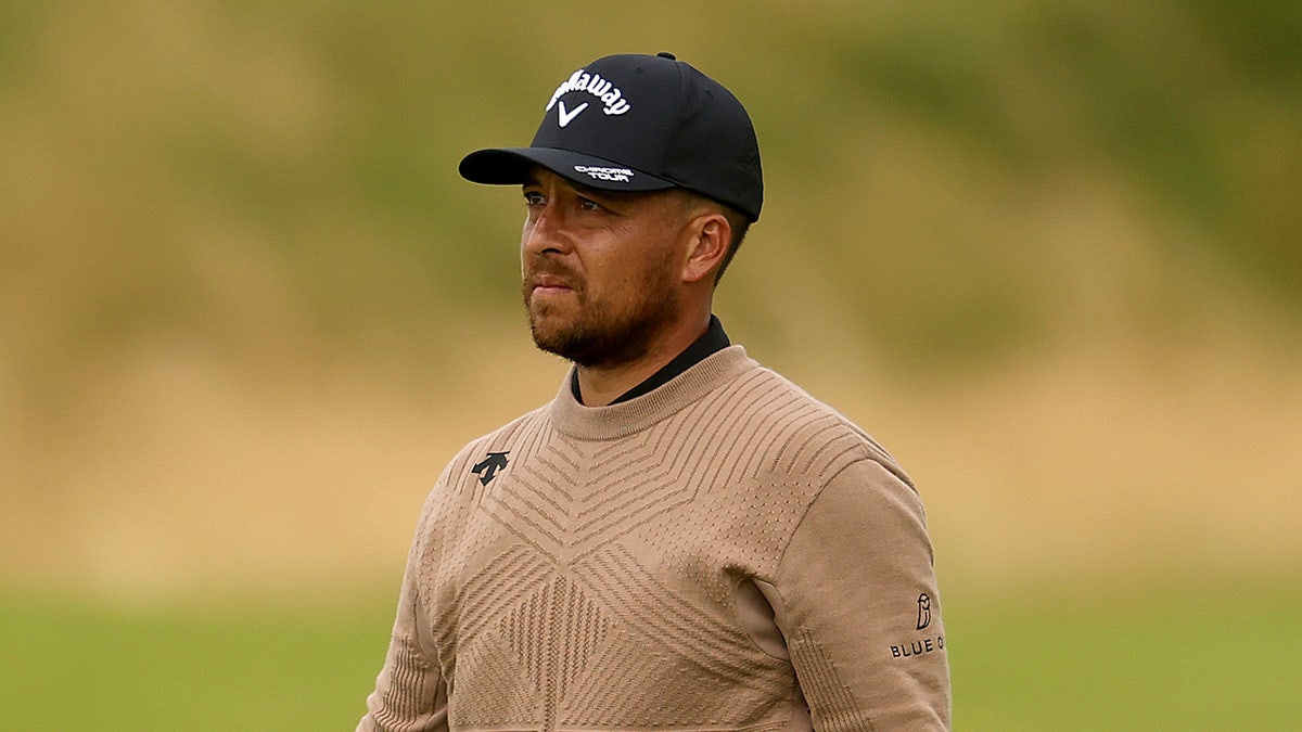 Xander Schauffele looks on