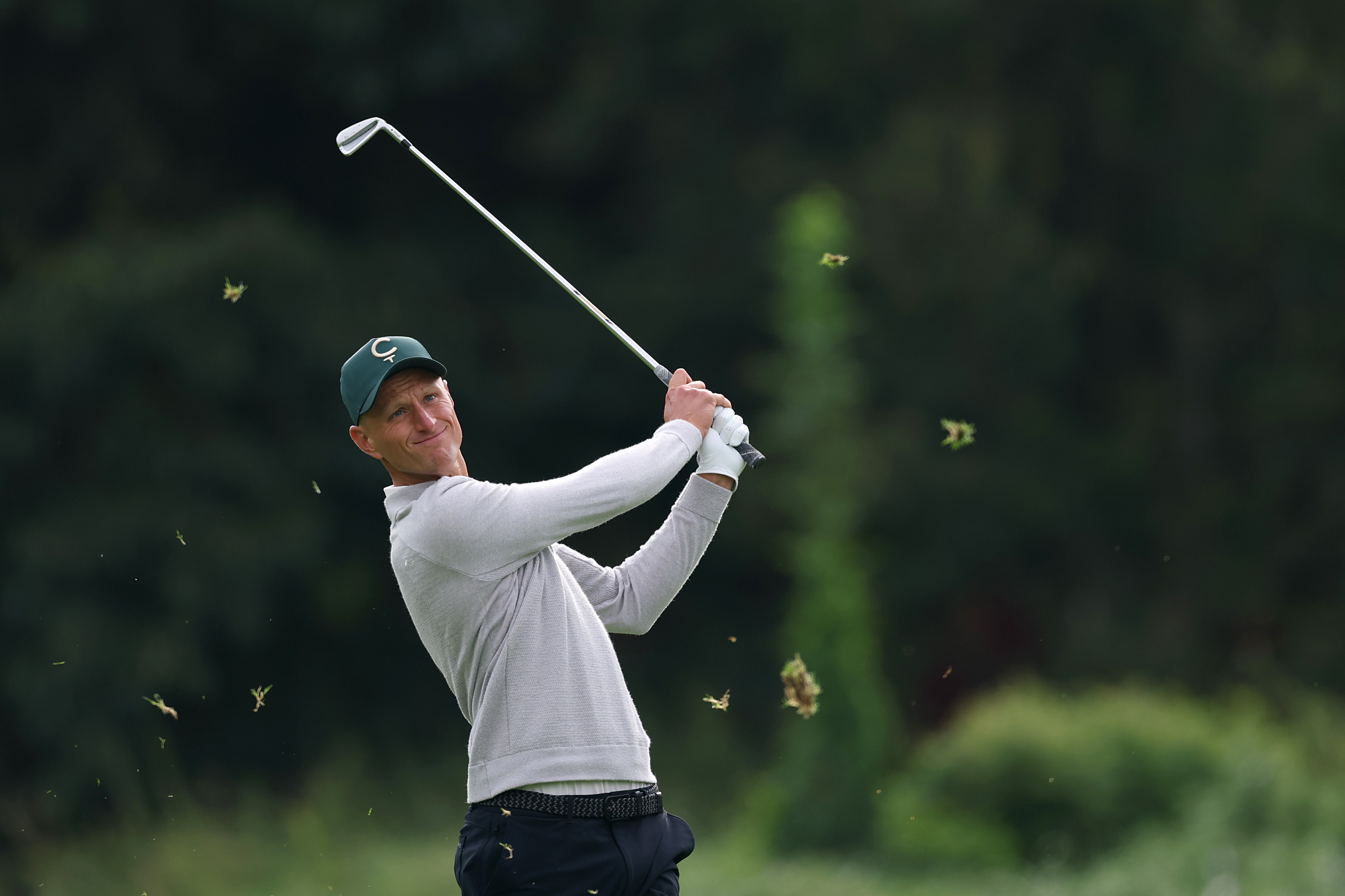 Adrian Meronk hits an iron shot