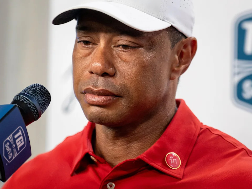 Tiger Woods wears a pin honoring his late mother Kultida, who died two weeks ago. He spoke about his loss after playing a match against New York Golf Club at SoFi Center at Palm Beach State College on February 18, 2025, in Palm Beach Gardens, Florida.