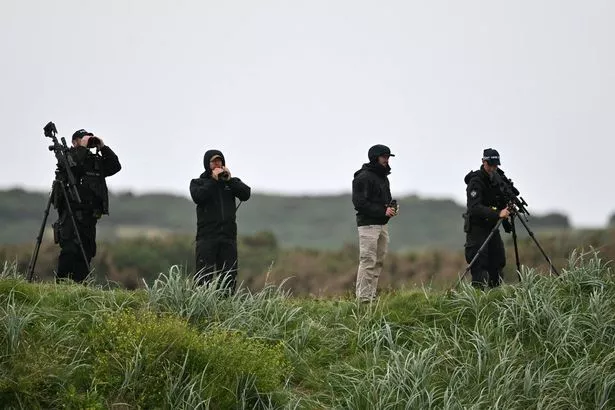 Snipers and security personnel inspect the area before US President Donald Trump he plays golf at the Trump Turnberry Golf Courses
