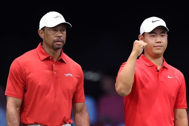 Tiger Woods and Tom Kim watch on during a TGL match