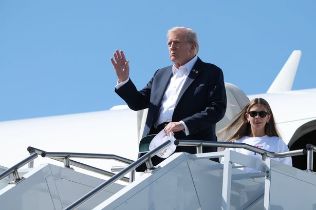 FARMINGDALE, NEW YORK - SEPTEMBER 26: U.S. President Donald Trump walks off Air Force One with his granddaughter, Kai Trump, after arriving at the Republic Airport on September 26, 2025 in Farmingdale, New York. Trump spent the day attending the first day of the 2025 Ryder Cup. (Photo by Anna Moneymaker/Getty Images)