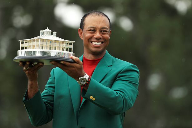 AUGUSTA, GEORGIA - APRIL 14: Tiger Woods of the United States celebrates with the Masters Trophy during the Green Jacket Ceremony after winning the Masters at Augusta National Golf Club on April 14, 2019 in Augusta, Georgia. (Photo by Mike Ehrmann/Getty Images)
