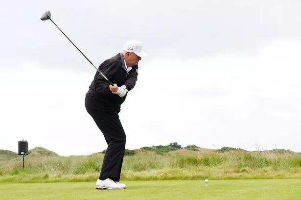 A photo of Donald Trump playing golf 