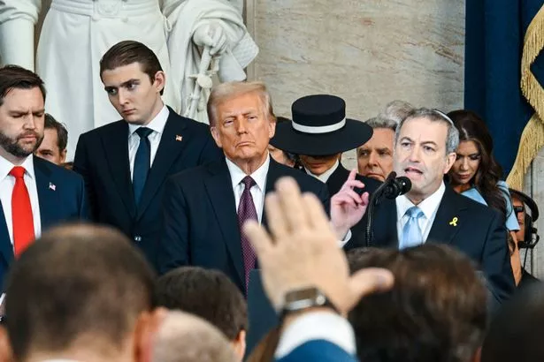 U.S. President Donald Trump listen to Yeshiva University's President Rabbi Dr. Ari Berman alongside his son Barron Trump and Vice President JD Vance during his inauguration in the U.S. Capitol Rotunda on January 20, 2025 in Washington, DC. Donald Trump takes office for his second term as the 47th President of the United States
