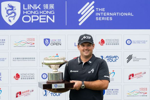 Patrick Reed poses with the Hong Kong Open trophy