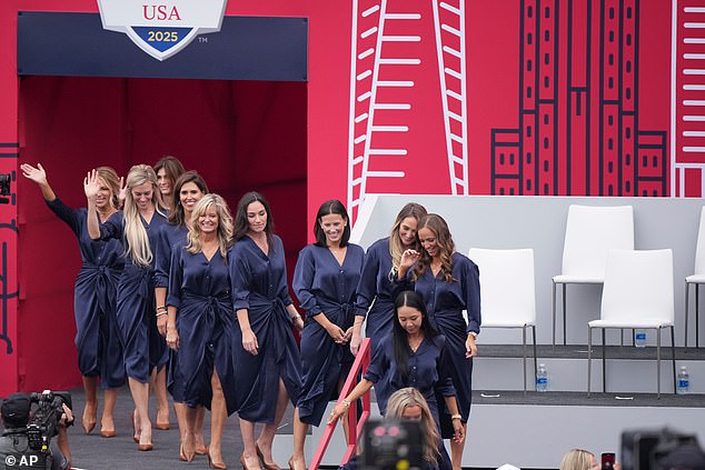 While the Team USA WAGs went with a sleek navy outfit as they made their stage appearance