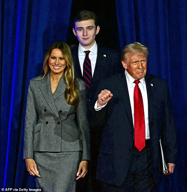 Several rumors have recently swirled around suggesting Barron was having a hard time at school. (Pictured: Melania, Barron and Donald in November 2024)