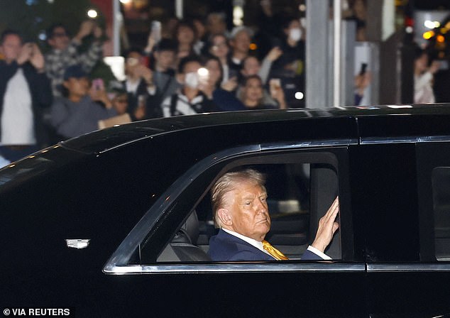 President Donald Trump is seen riding in the Beast en route to the Imperial Palace after landing in Tokyo, Japan