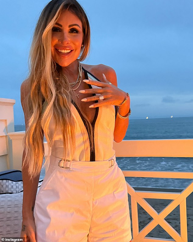 Uchitel poses with her 10.5 carat diamond engagement ring