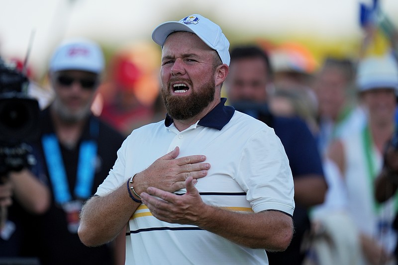 Europe's Shane Lowry celebrates after making the winning putt putt on the 18th hole during their singles match on the Bethpage Black golf course at the Ryder Cup golf tournament, Sunday, Sept. 28, 2025, in Farmingdale, N.Y. (AP Photo/Seth Wenig)