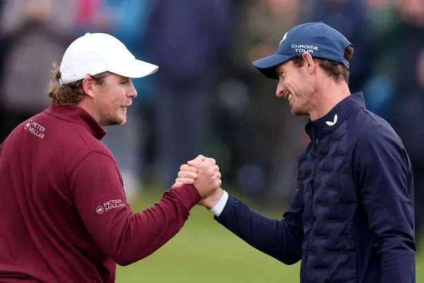 Eddie Pepperell of England and Former Tennis Player, Andy Murray shake hands after finishing their round on the 18th green on day one of the Alfred Dunhill Links Championship