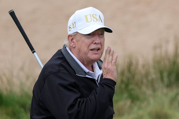 U.S. President Donald Trump tees off after opening of his new golf course at his Trump International Golf links resort