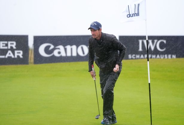 Andy Murray walks on the course