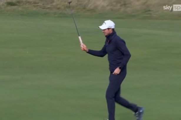Andy Murray walks on the green