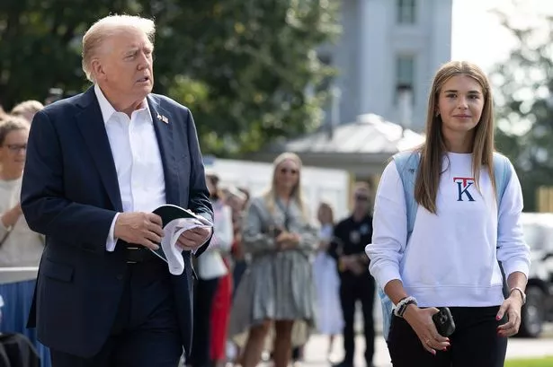 WASHINGTON, DC - SEPTEMBER 26: U.S. President Donald Trump, joined by his granddaughter Kai Trump, departs the White House on September 26, 2025 in Washington, DC. Under pressure from Trump, the DOJ indicted former FBI Director James Comey on counts of making false statements and obstruction of a congressional proceeding related to the September 2020 Russia investigation. (Photo by Kevin Dietsch/Getty Images)