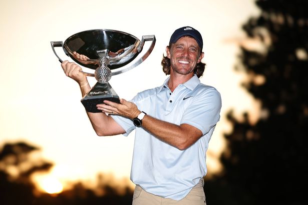 Tommy Fleetwood of England poses with the Fedex Cup trophy after winning the final round of the TOUR Championship 2025 at East Lake Golf Club on August 24, 2025 in Atlanta, Georgia.
