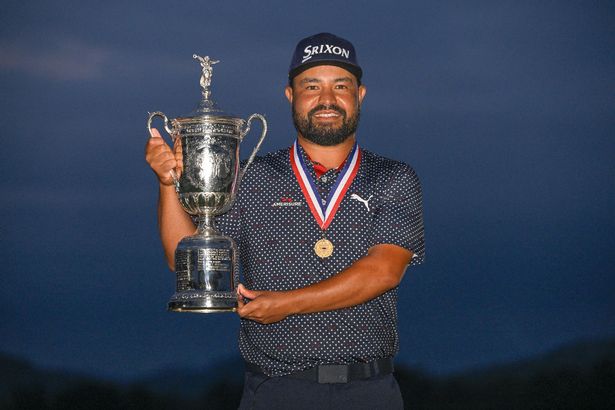 J.J. Spaun holds the U.S. Open trophy