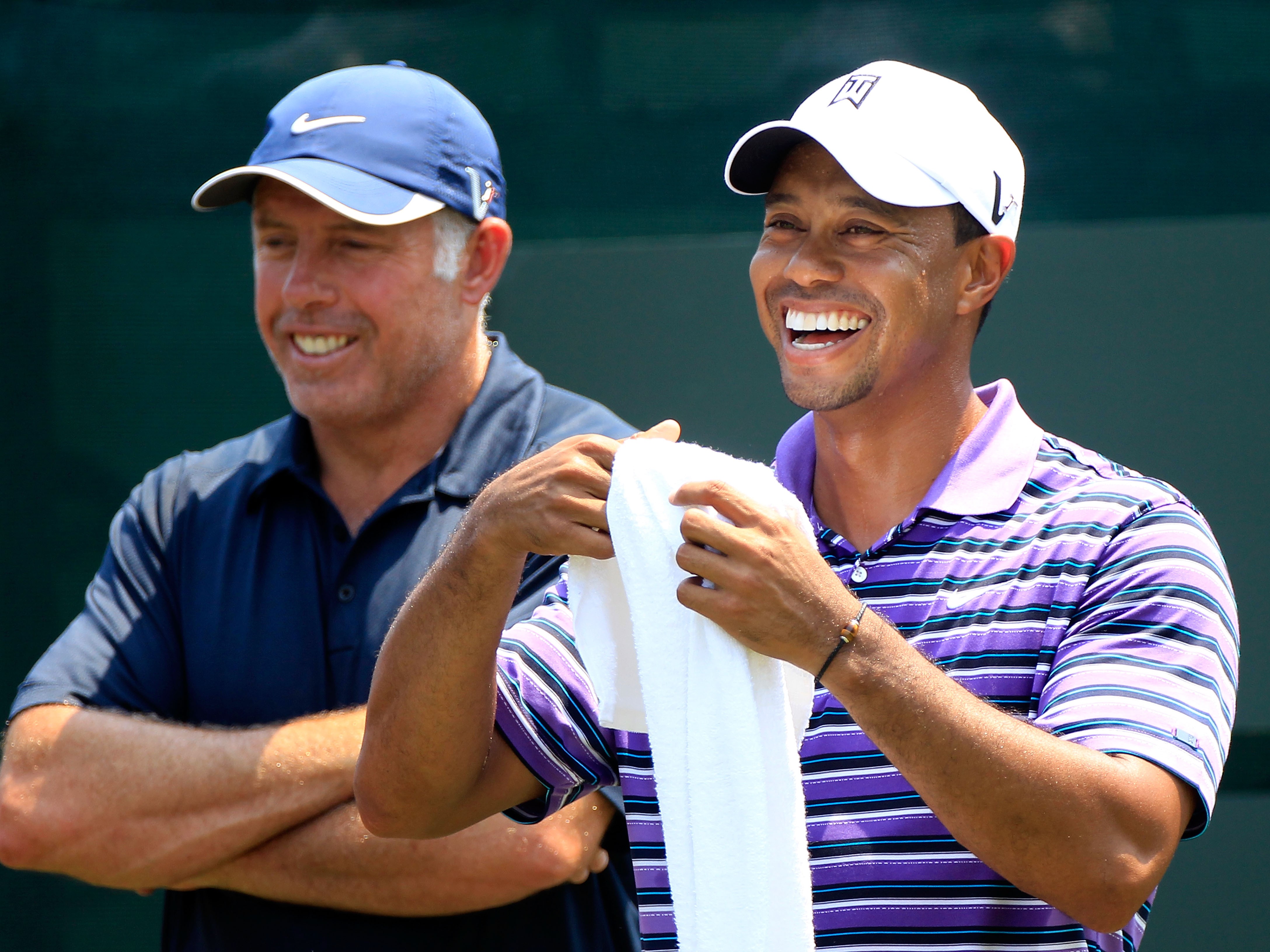 Steve Williams and Tiger Woods laughing at something