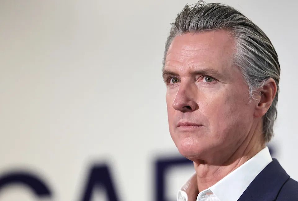 California Governor Gavin Newsom has slammed President Donald Trump for golfing and selling Trump Watches amid the government shutdown. / Mario Tama/Getty Images