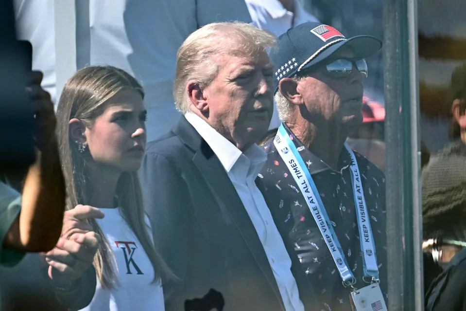 The commander-in-chief suited up for the occasion and wore white golf shoes. AP