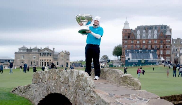 Scotland's Robert McIntyre poses with the trophy after winning the 2025 Alfred Dunhill Links Championship at the Old Course, St Andrews, Scotland, Sunday, Oct. 5, 2025. (Jane Barlow/PA via AP)