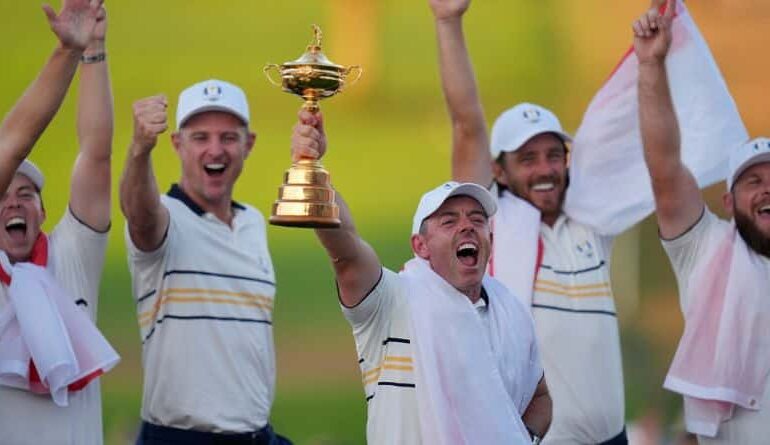 Europe's Rory McIlroy poses with the trophy after winning the Ryder Cup golf tournament against the United States on the Bethpage Black golf course, Sunday, Sept. 28, 2025, in Farmingdale, N.Y. (AP Photo/Seth Wenig)